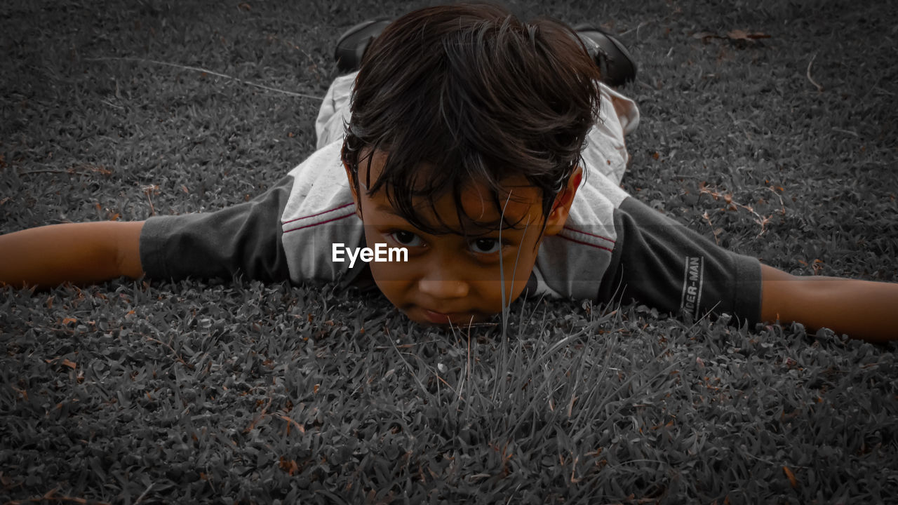 High angle portrait of boy on field