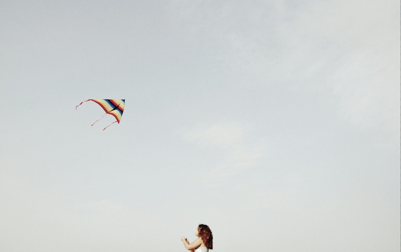 View of girl flying kite