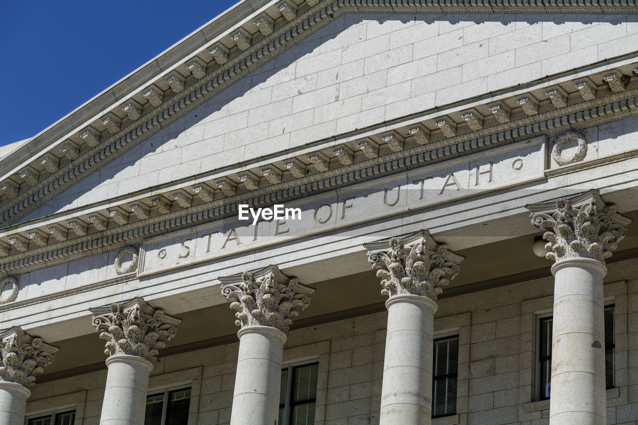 The architecture of buildings windows, stucco molding, and columns on a sunny day in the usa