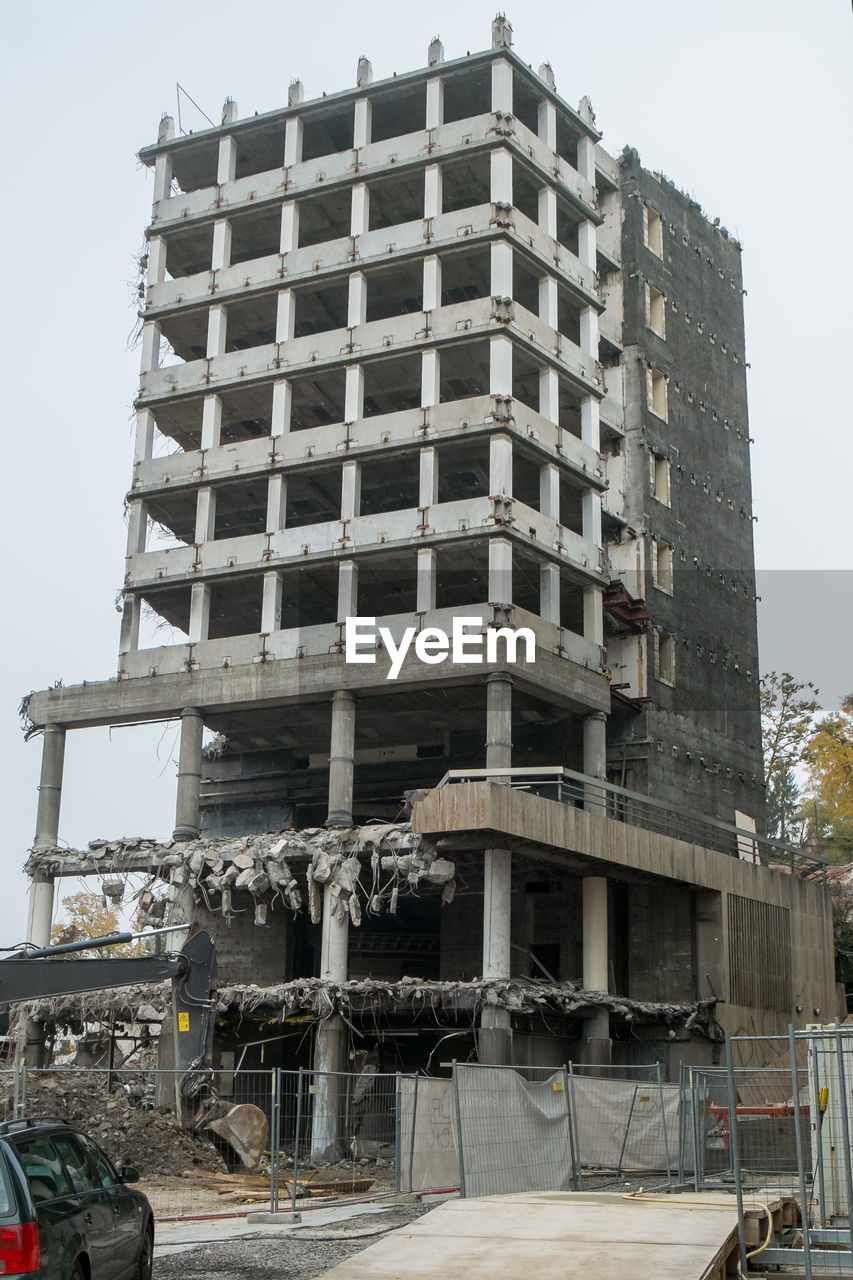 Low angle view of damaged building against sky