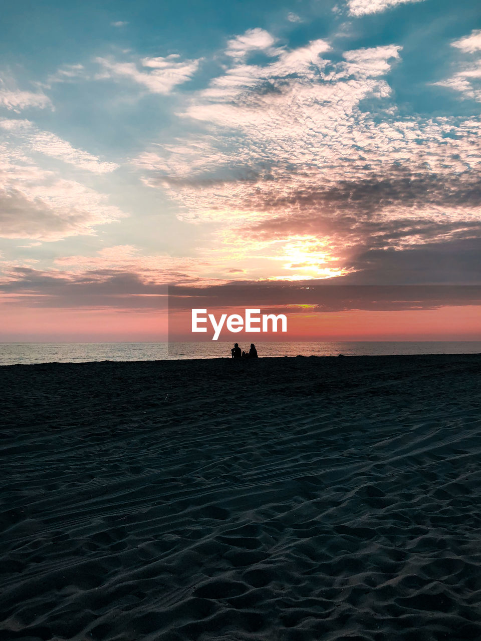 SCENIC VIEW OF SEA AGAINST ORANGE SKY