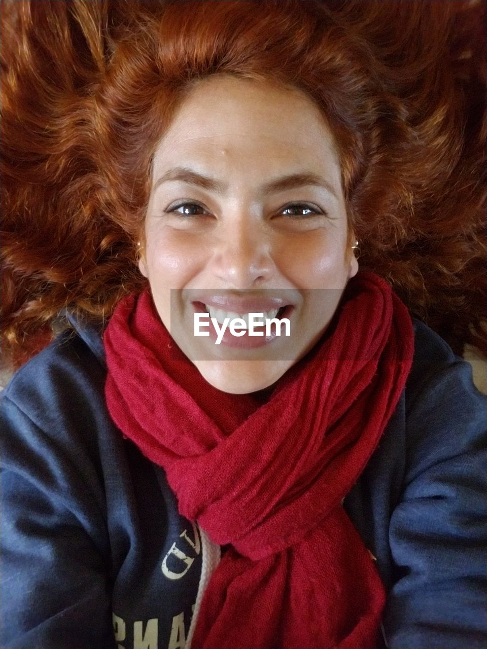 Portrait of young redhead woman smiling