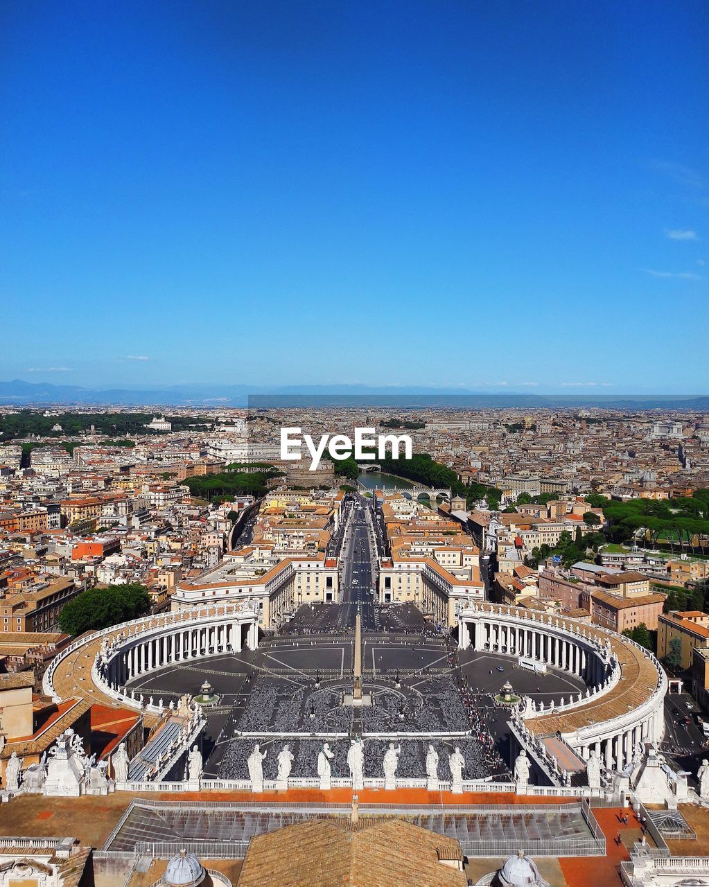 High angle view of cityscape against blue sky