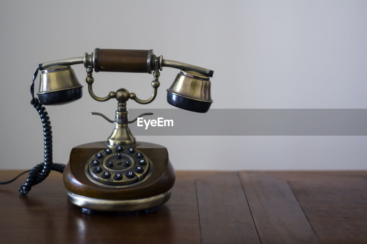 Close-up of telephone on table