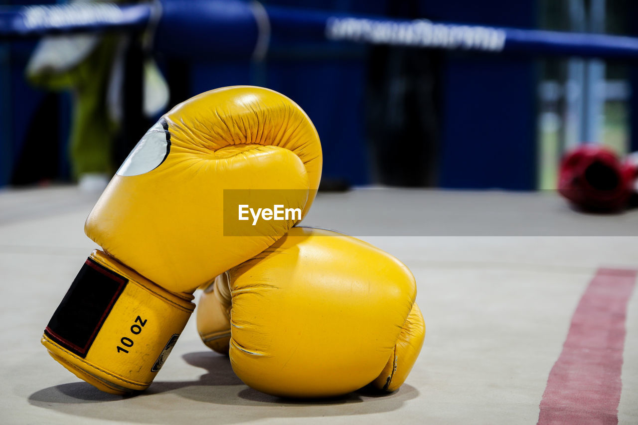 Close-up of gloves in boxing ring