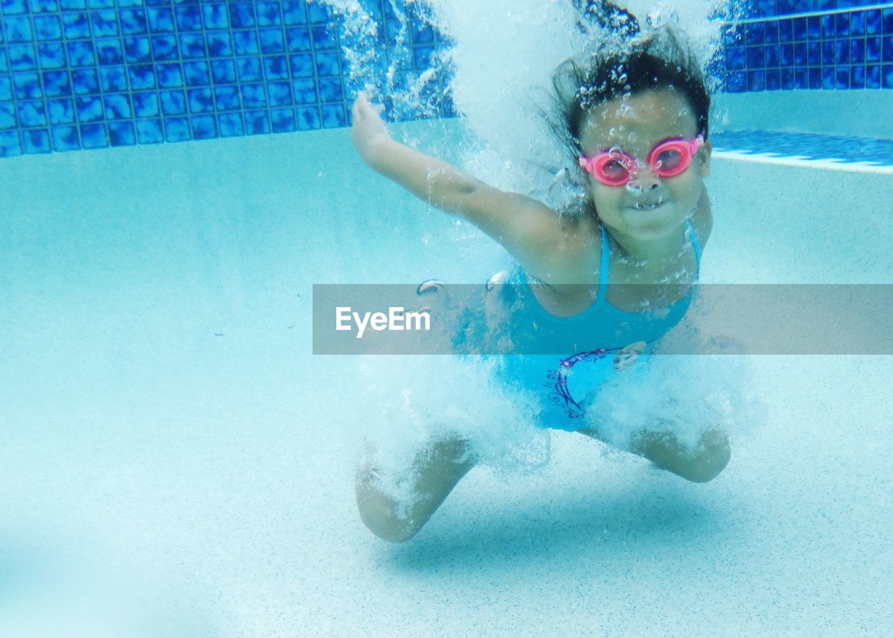 Girl swimming in pool