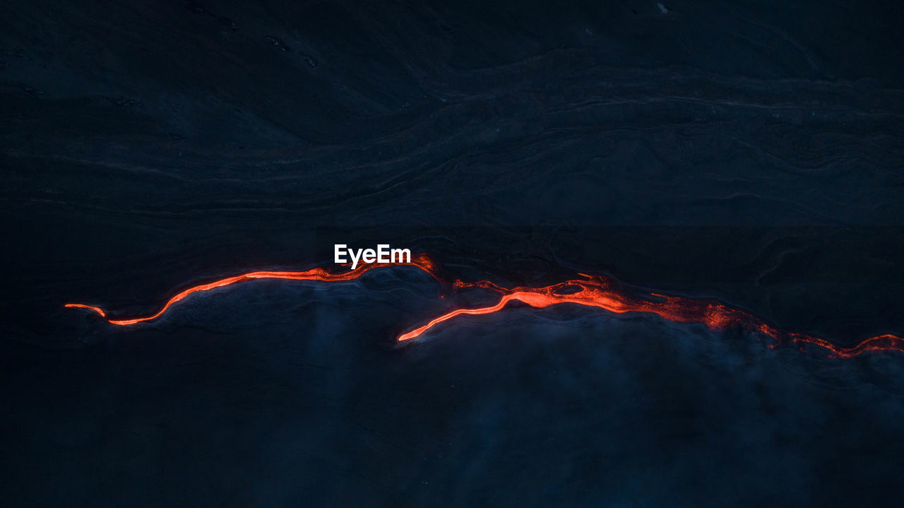 Lava flow from above on etna volcano in sicily - aerial panoramic view
