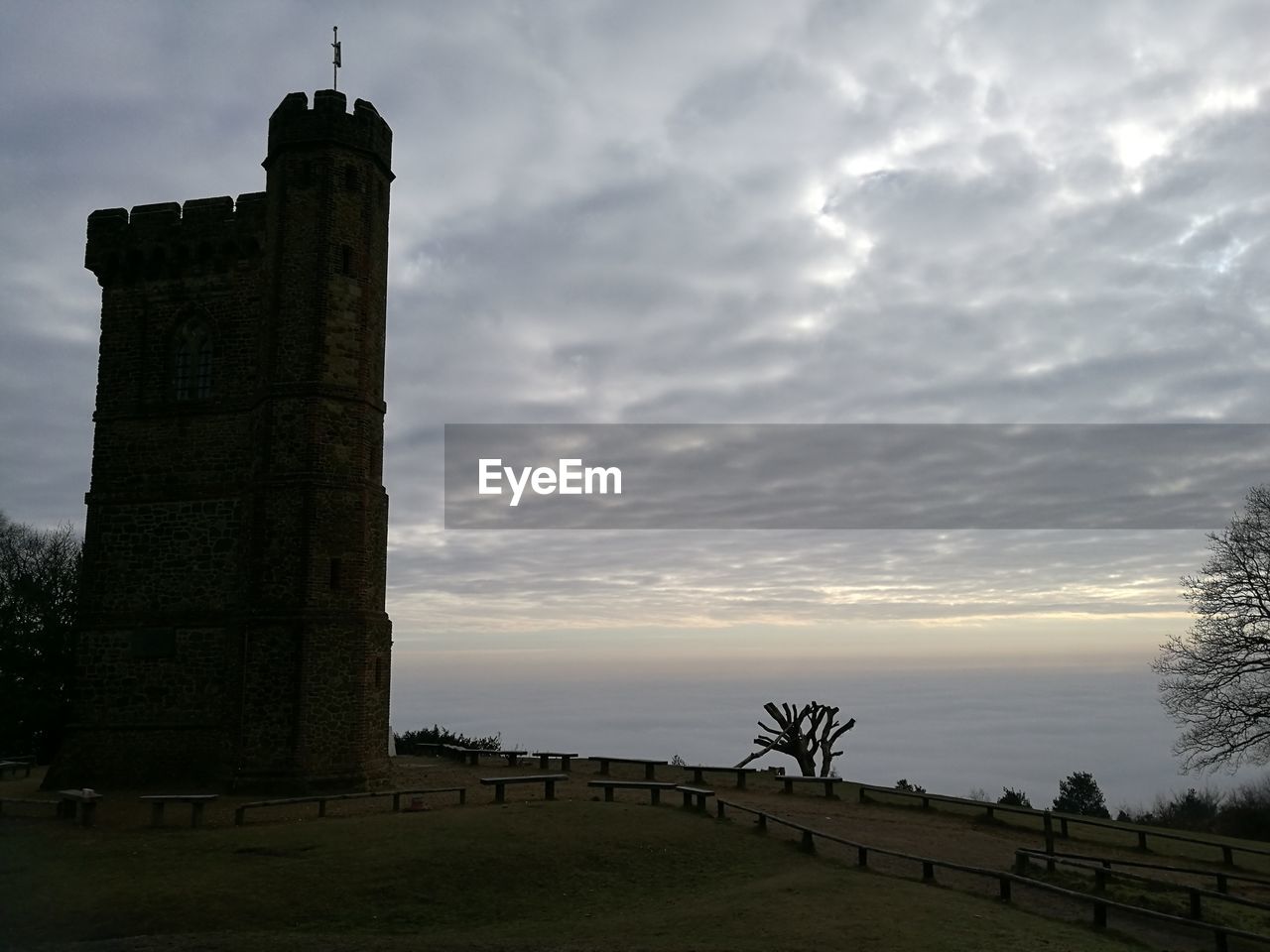 CASTLE AGAINST CLOUDY SKY