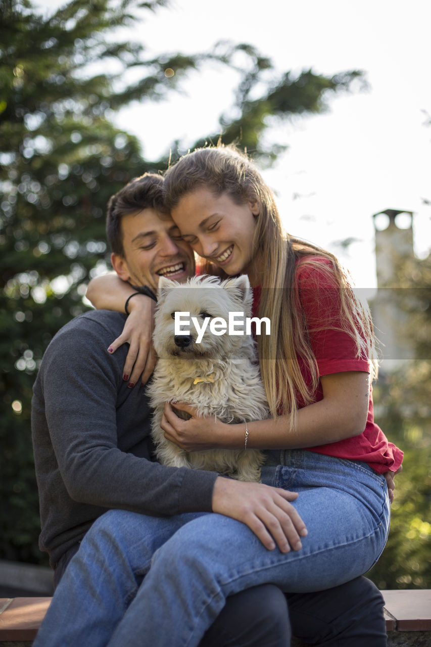 Happy couple sitting outdoors