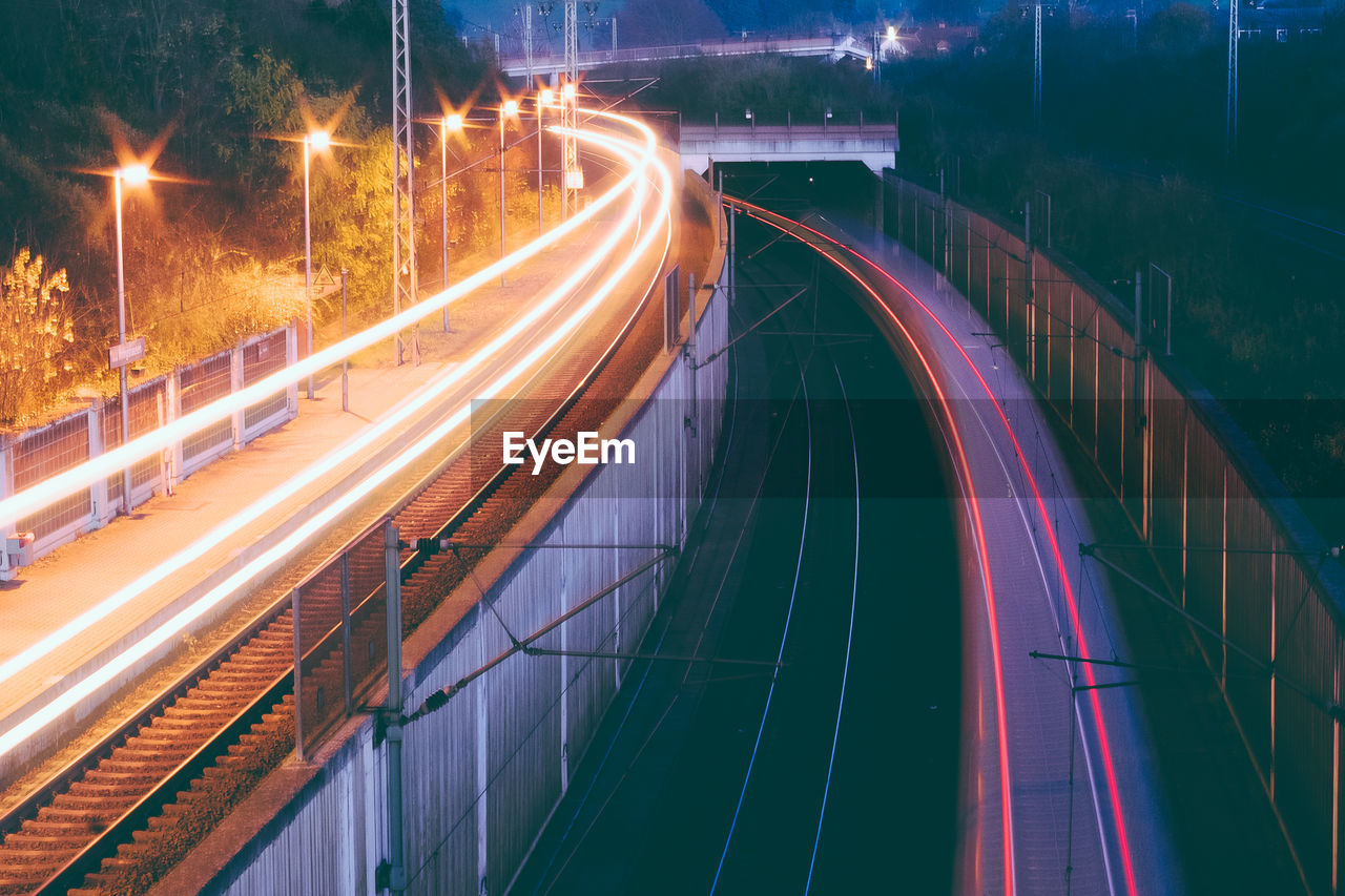 Light trails on highway in city at night