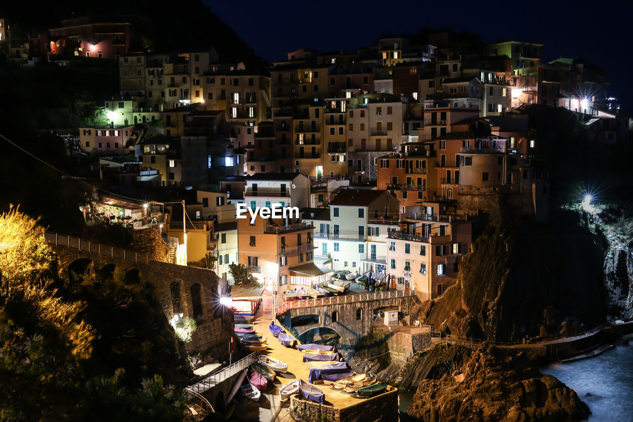 High angle view of illuminated houses in town