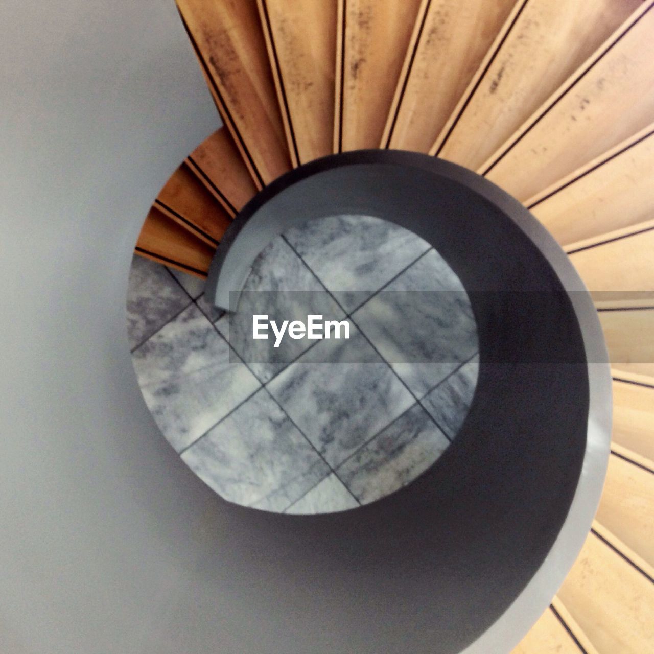 CLOSE-UP HIGH ANGLE VIEW OF SPIRAL STAIRCASE