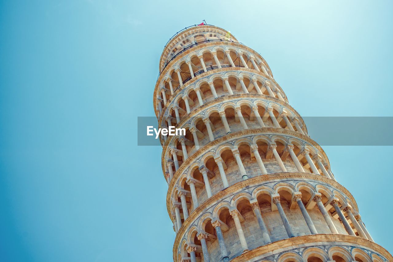 Low angle view of leaning tower of pisa against sky