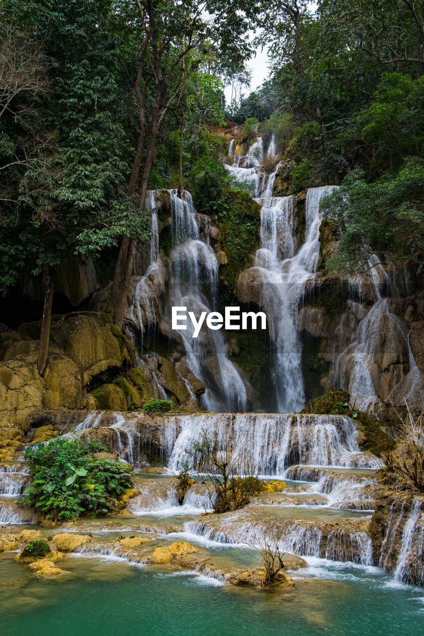 Kuang si waterfalls clear waters in area luang prabang, laos