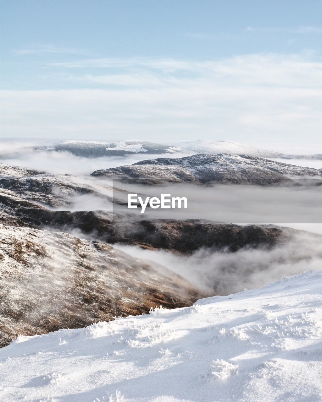 Scenic view of landscape against sky during winter