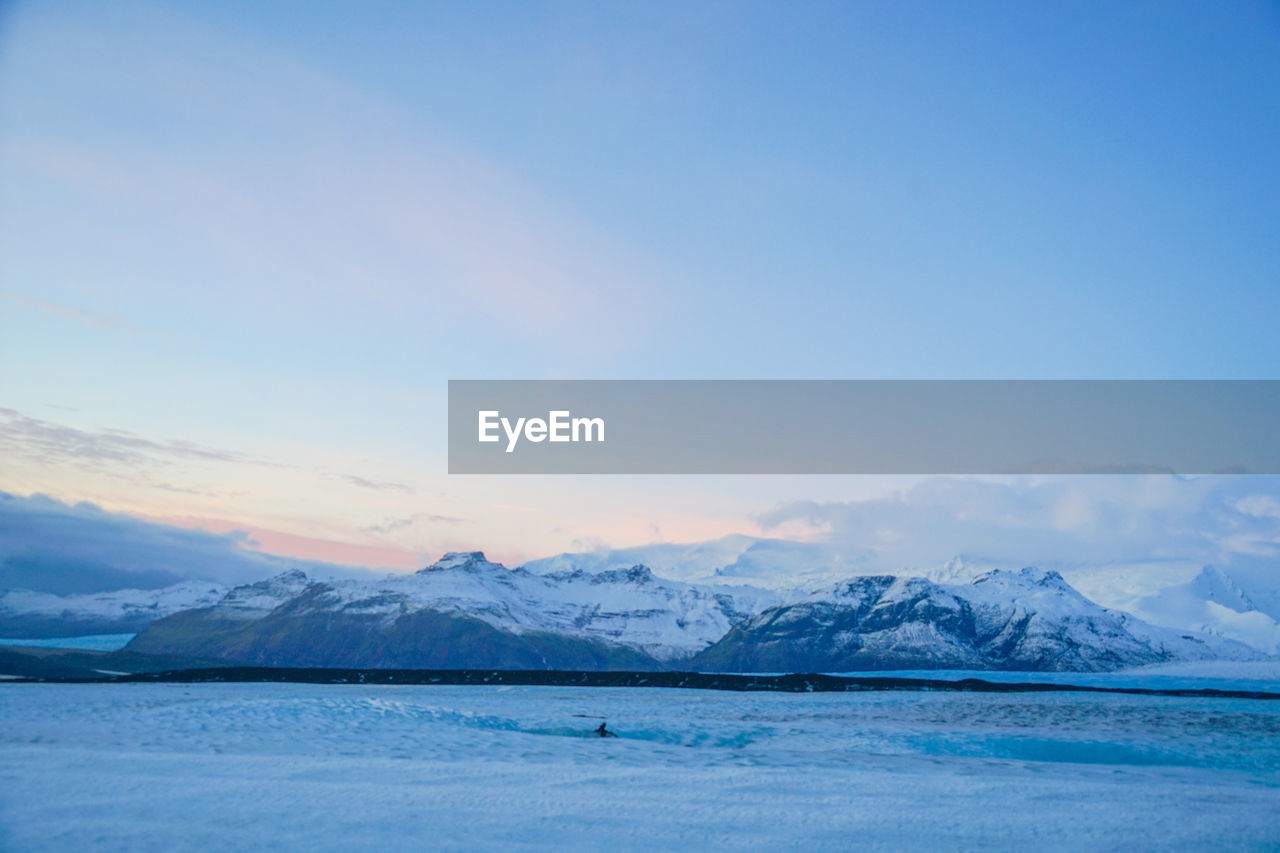 scenic view of snowcapped mountains against clear blue sky