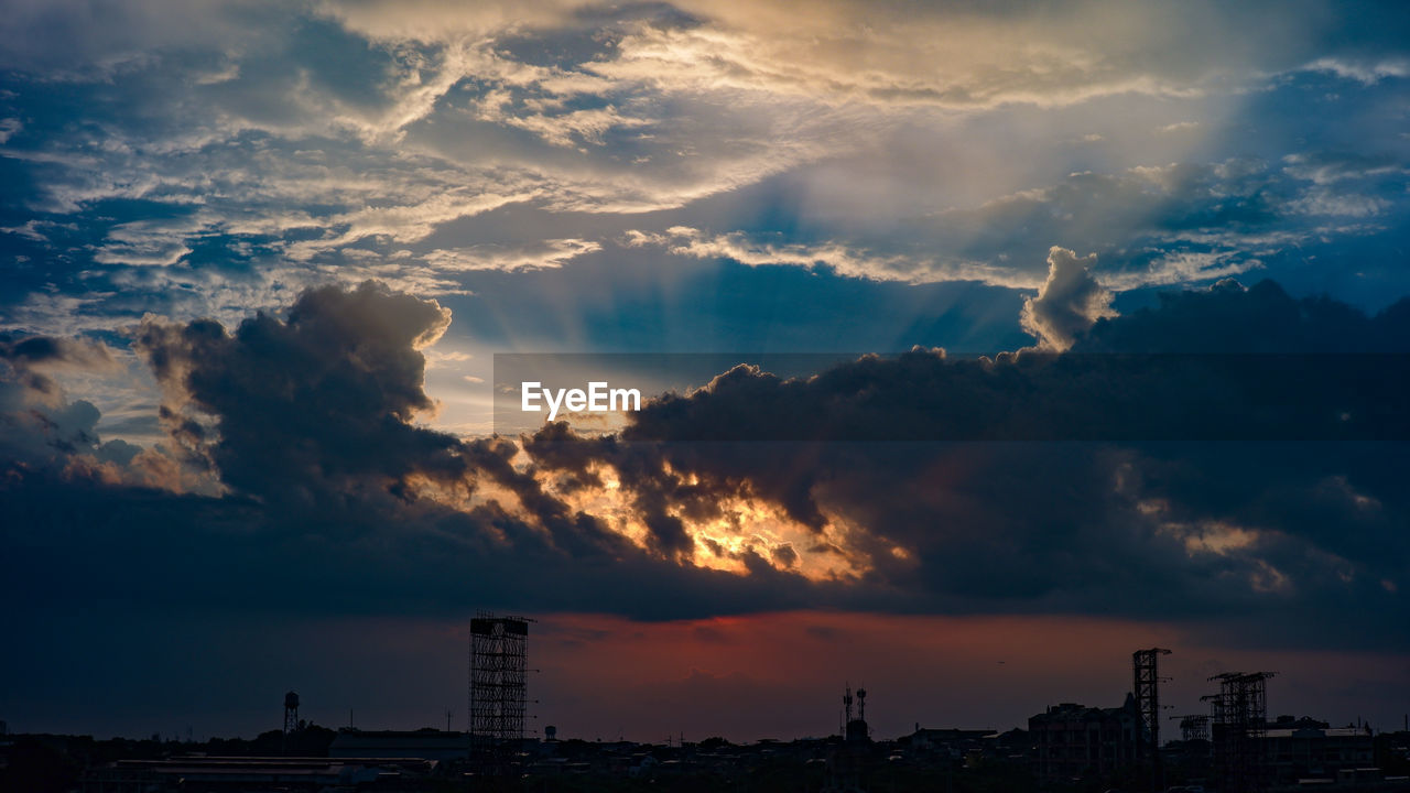 Panoramic view of buildings against sky during sunset