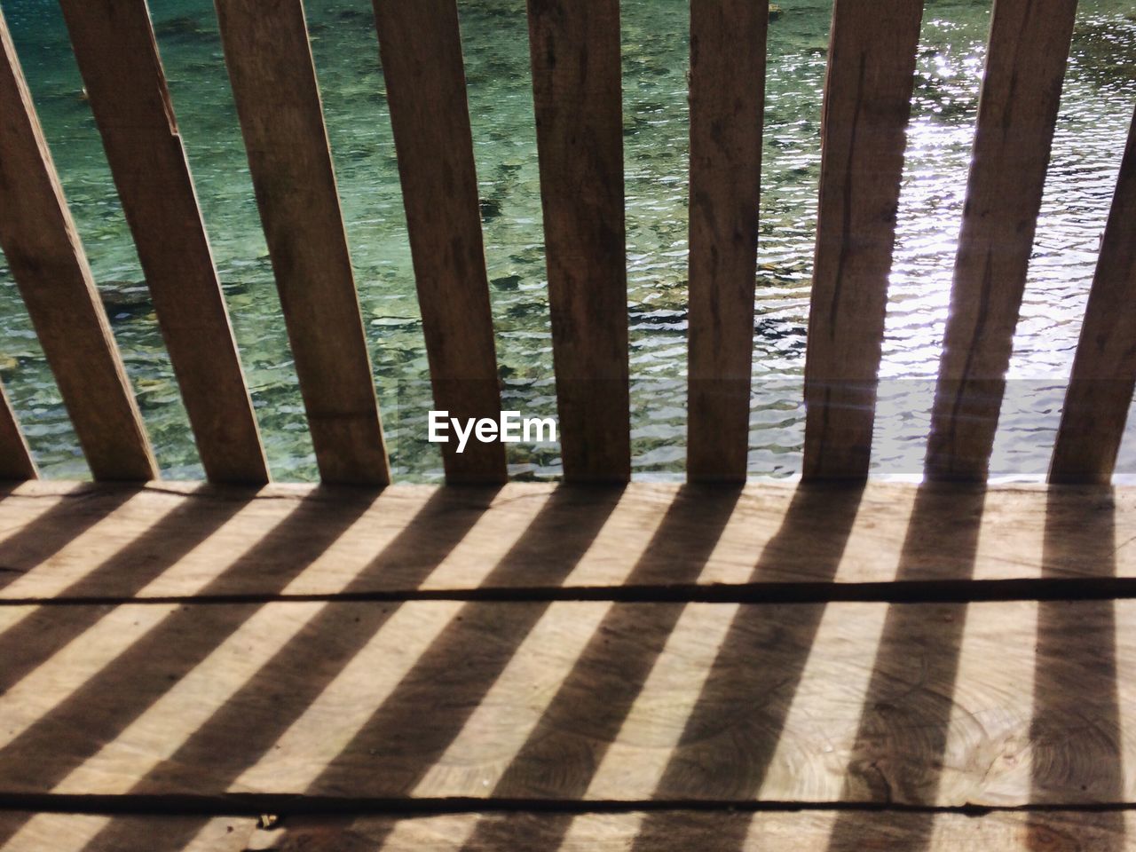 CLOSE-UP OF SHADOW OF WOODEN STRUCTURE