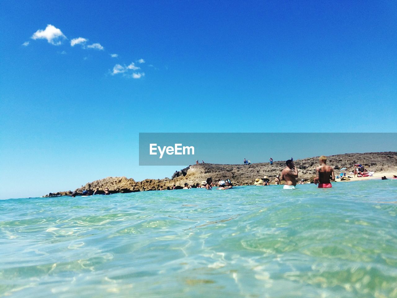 Scenic view of sea against clear blue sky