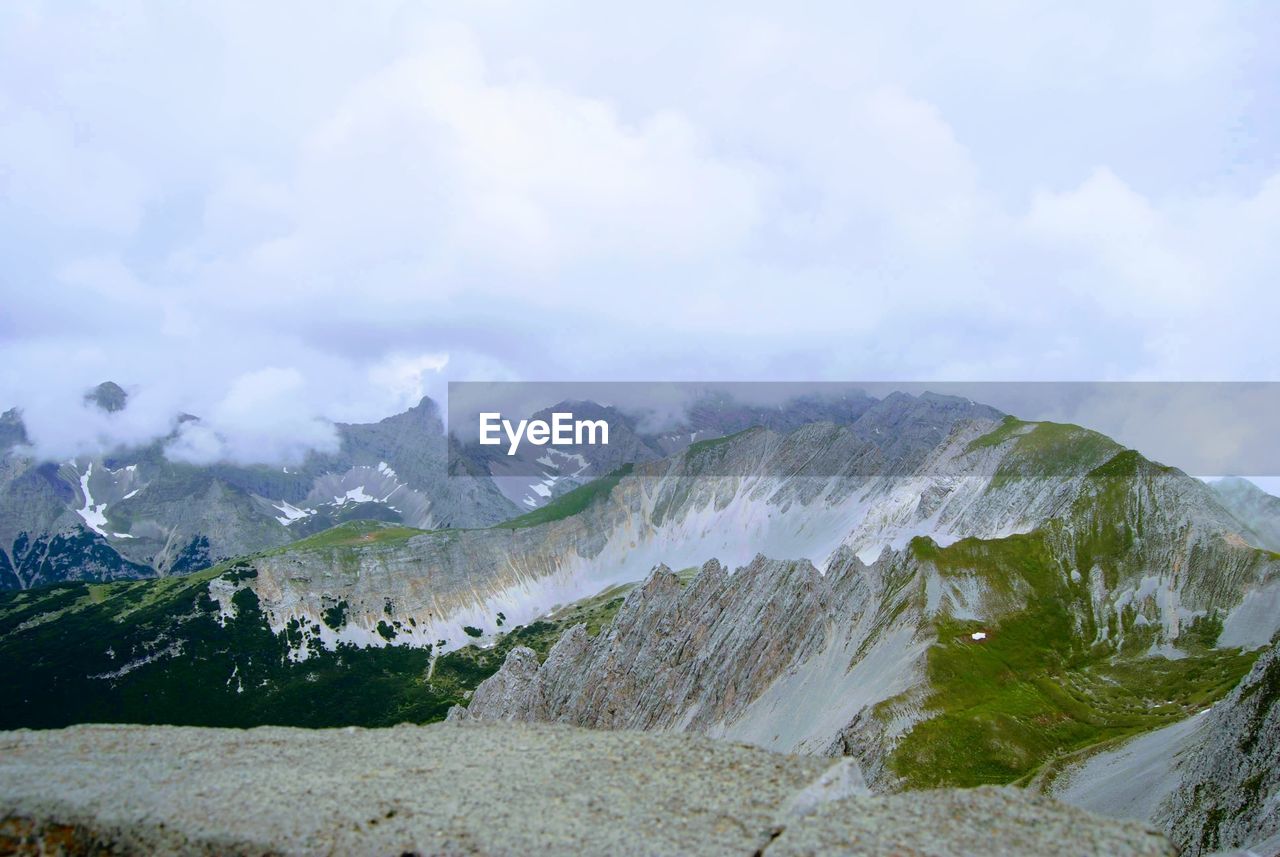 Scenic view of landscape and mountains against sky