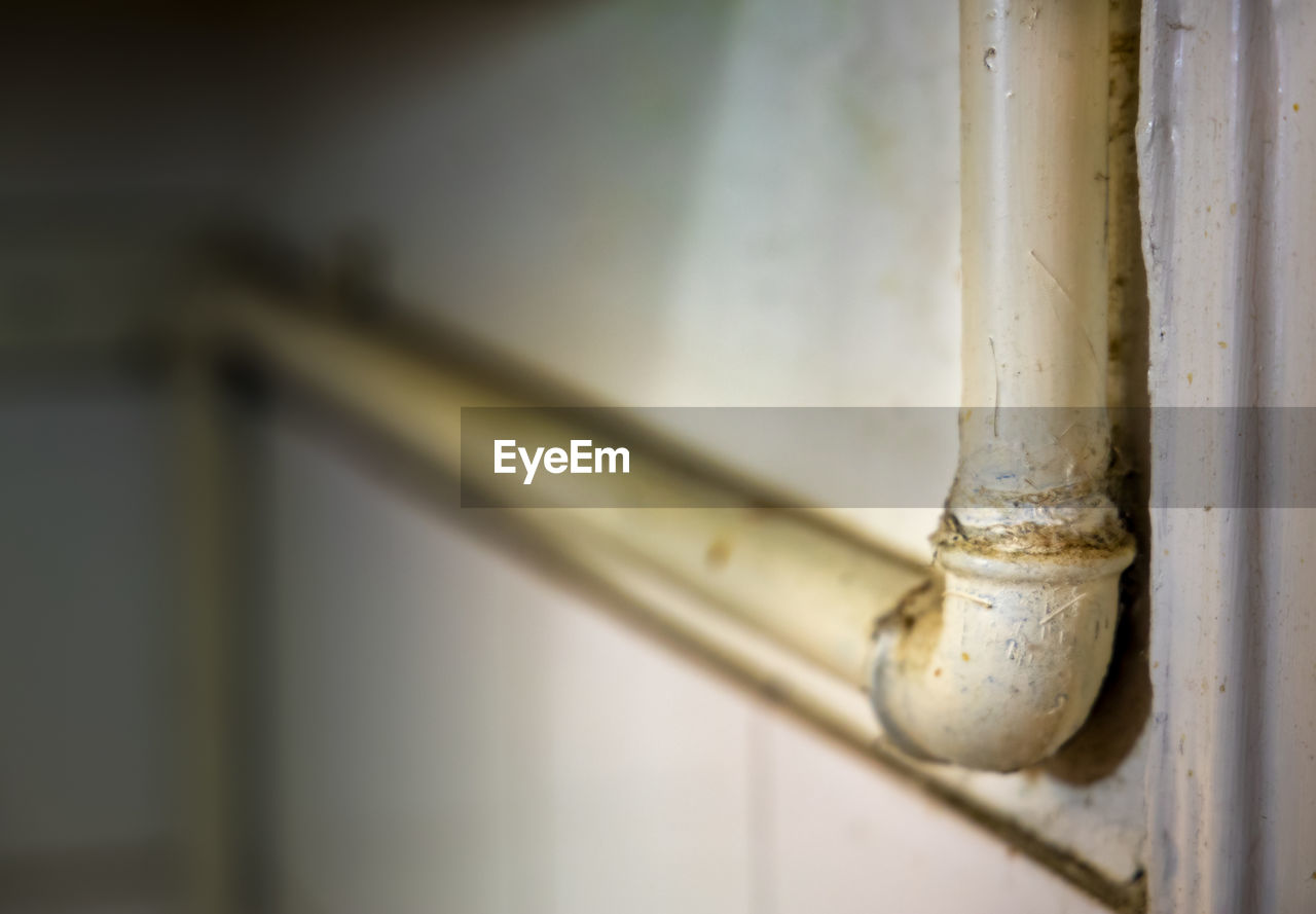 Close-up of metal gas pipe in old kitchen 