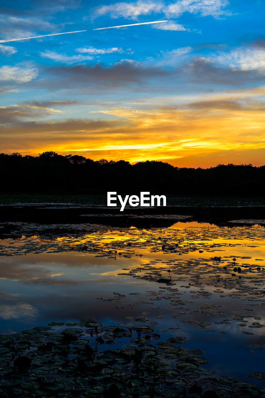 Scenic view of lake during sunset