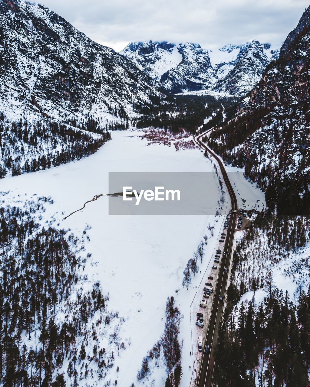 Scenic view of snow covered mountains against sky