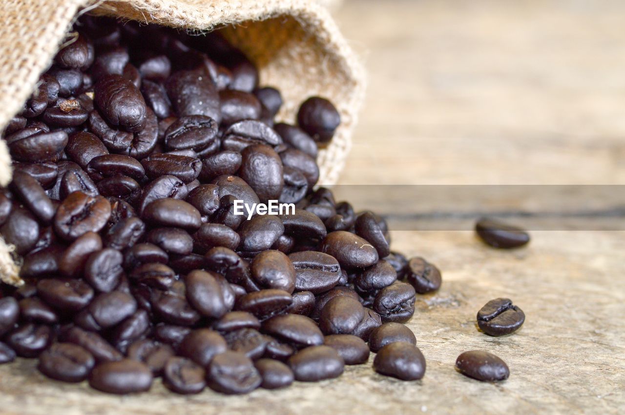 Close-up of coffee beans on table