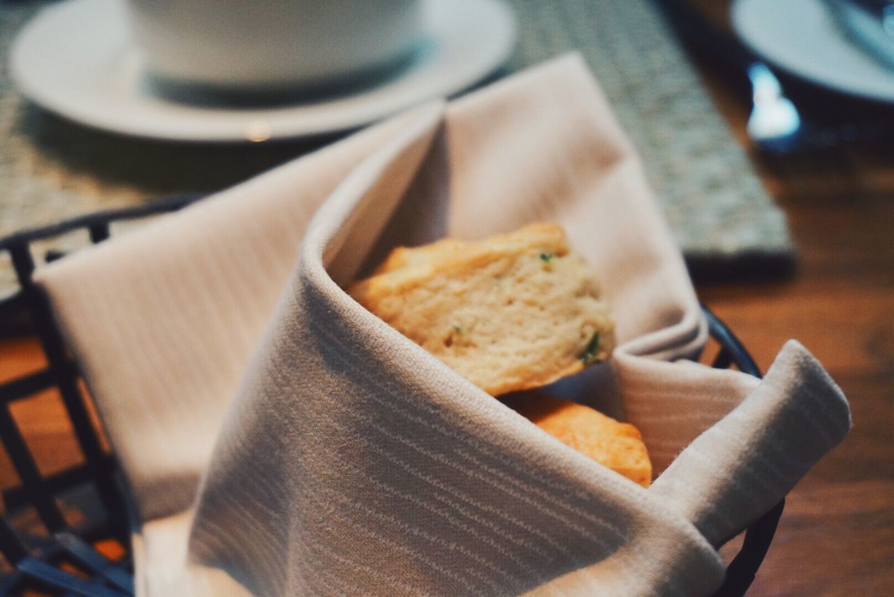 Close-up of toasted breads in napkin