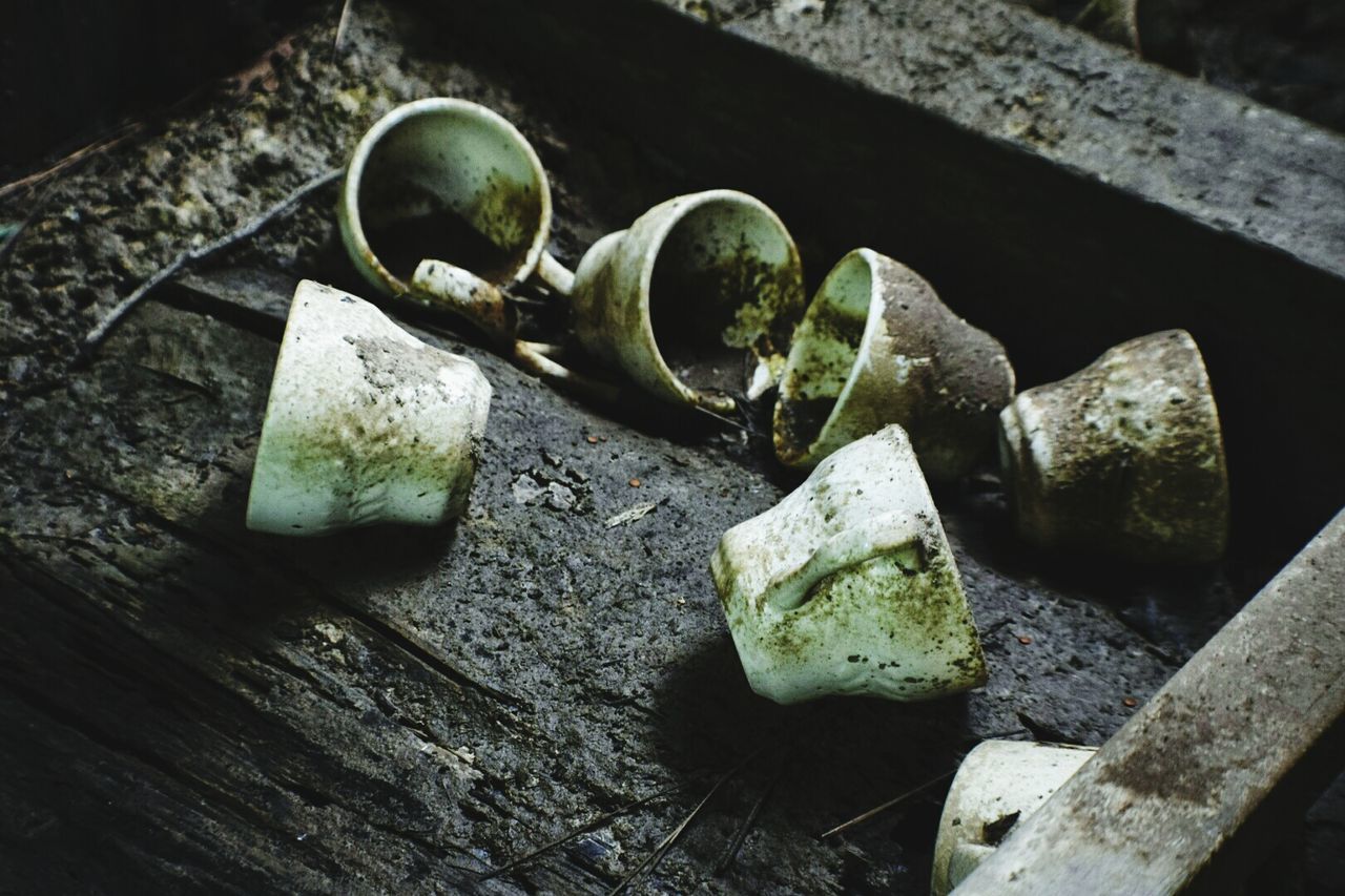 High angle view of abandoned cups on tray