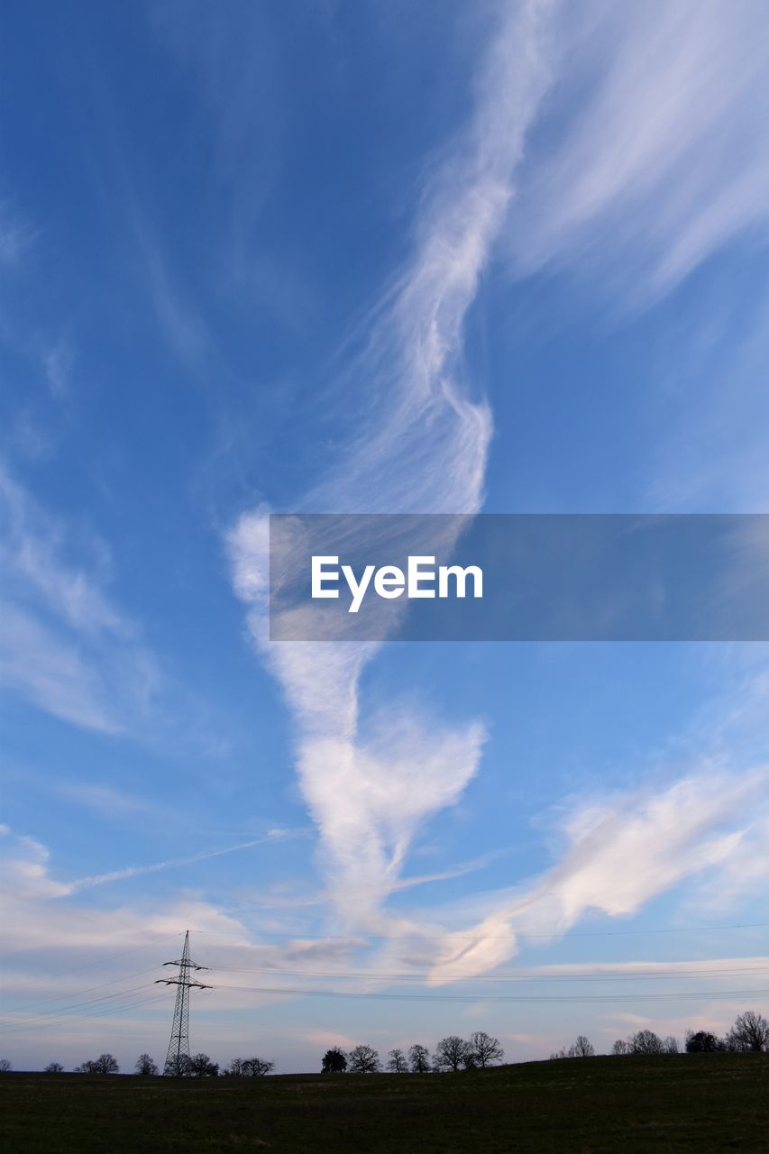 LOW ANGLE VIEW OF VAPOR TRAILS AGAINST BLUE SKY