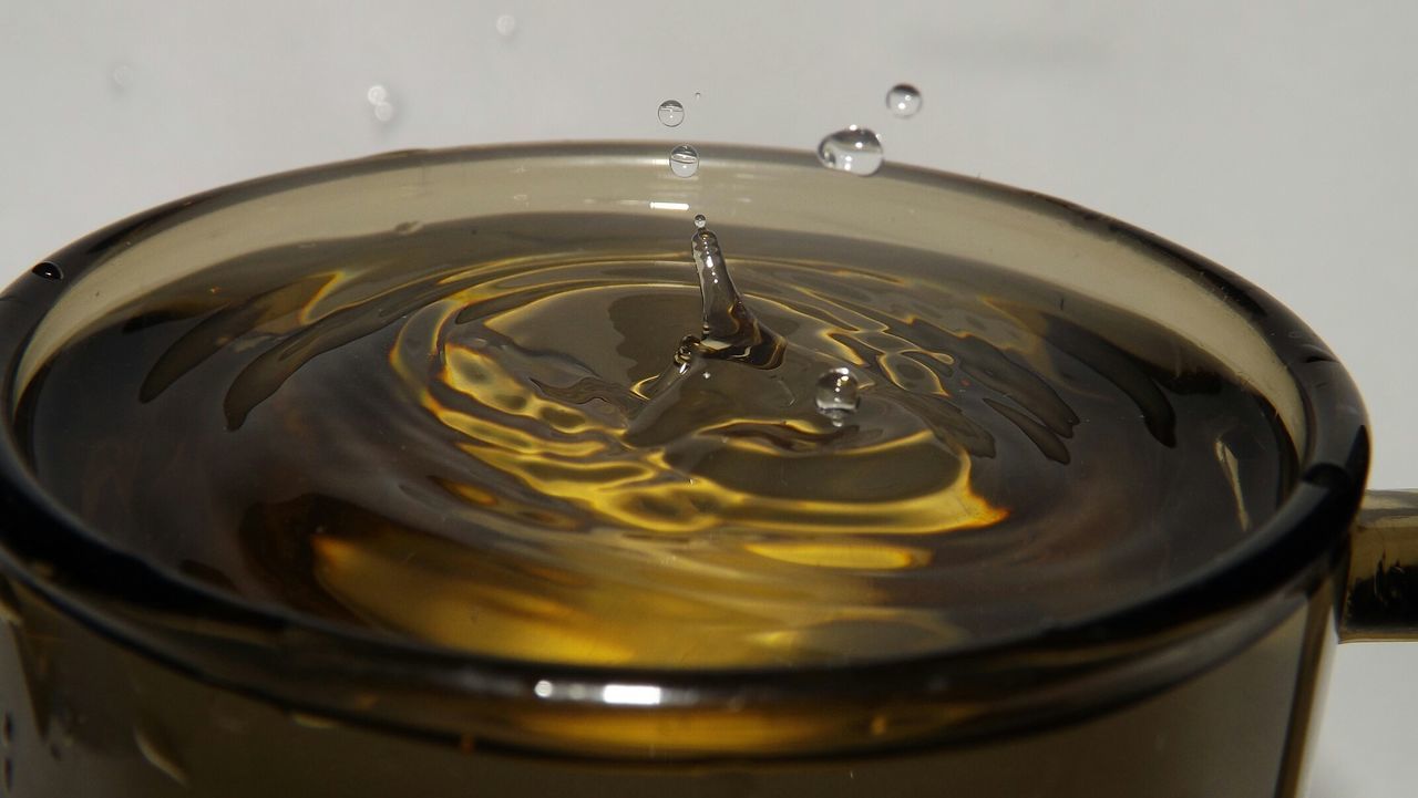 Close-up of drink over white background