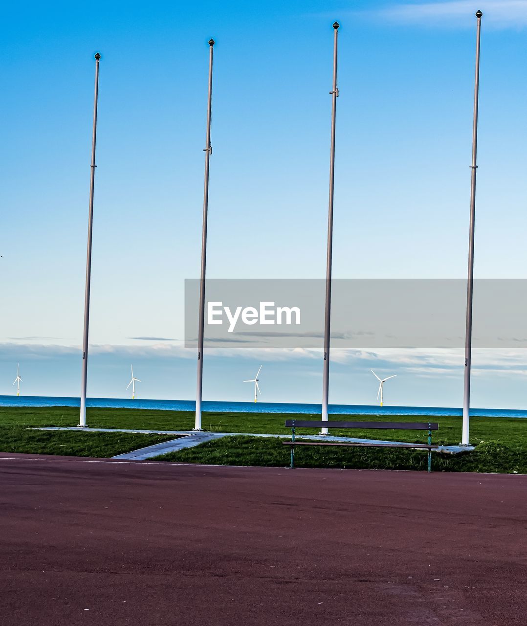 Wind turbines against sky