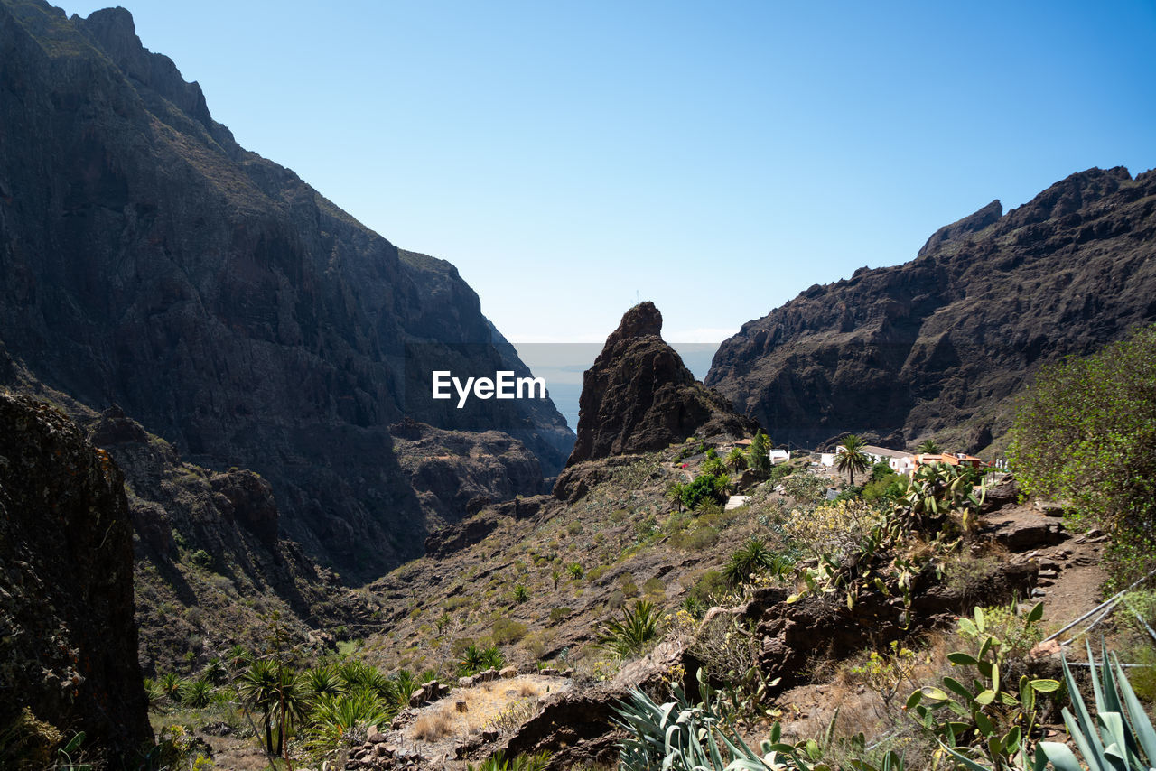 Scenic view of rocky mountains against clear sky