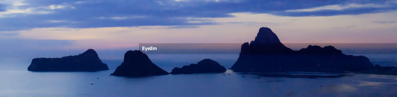 SCENIC VIEW OF ROCKS IN SEA AGAINST SKY