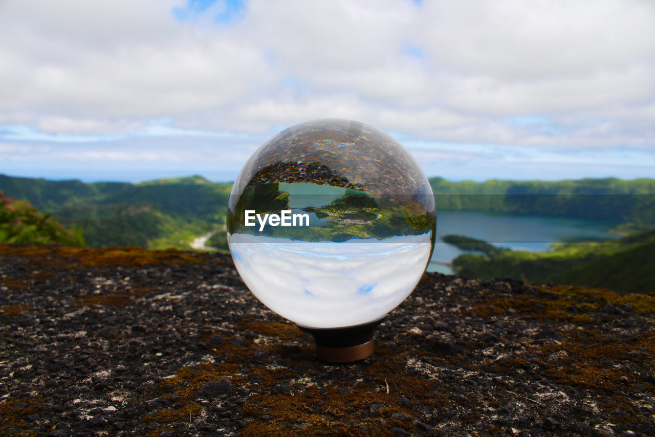 Close-up of crystal ball on glass