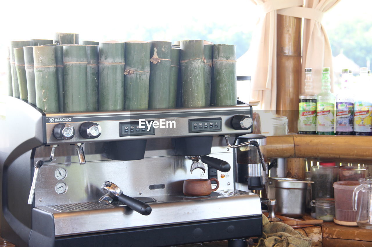 CLOSE-UP OF MACHINE IN KITCHEN