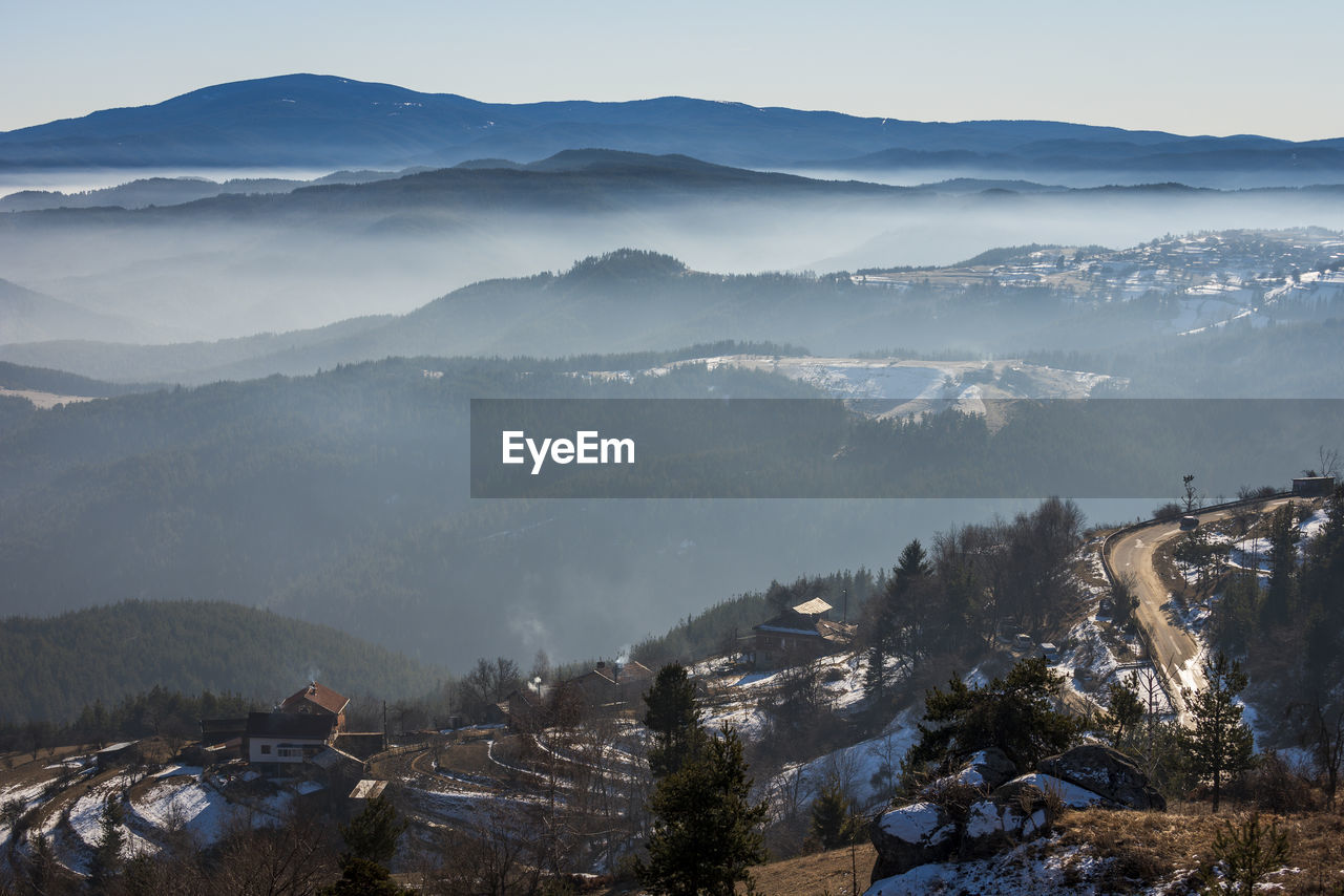 SCENIC VIEW OF MOUNTAINS AGAINST SKY DURING WINTER