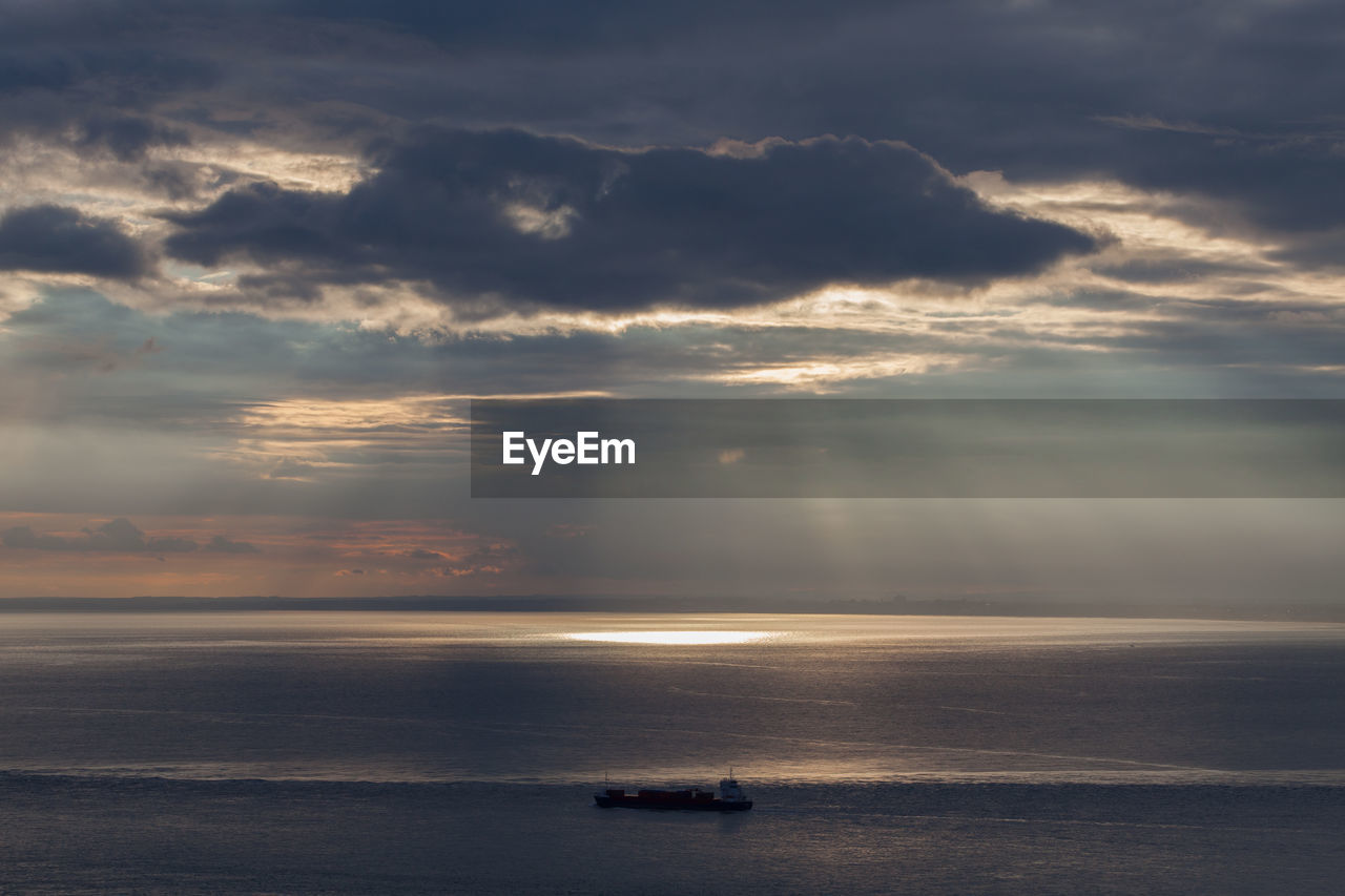 Scenic view of calm sea at sunset