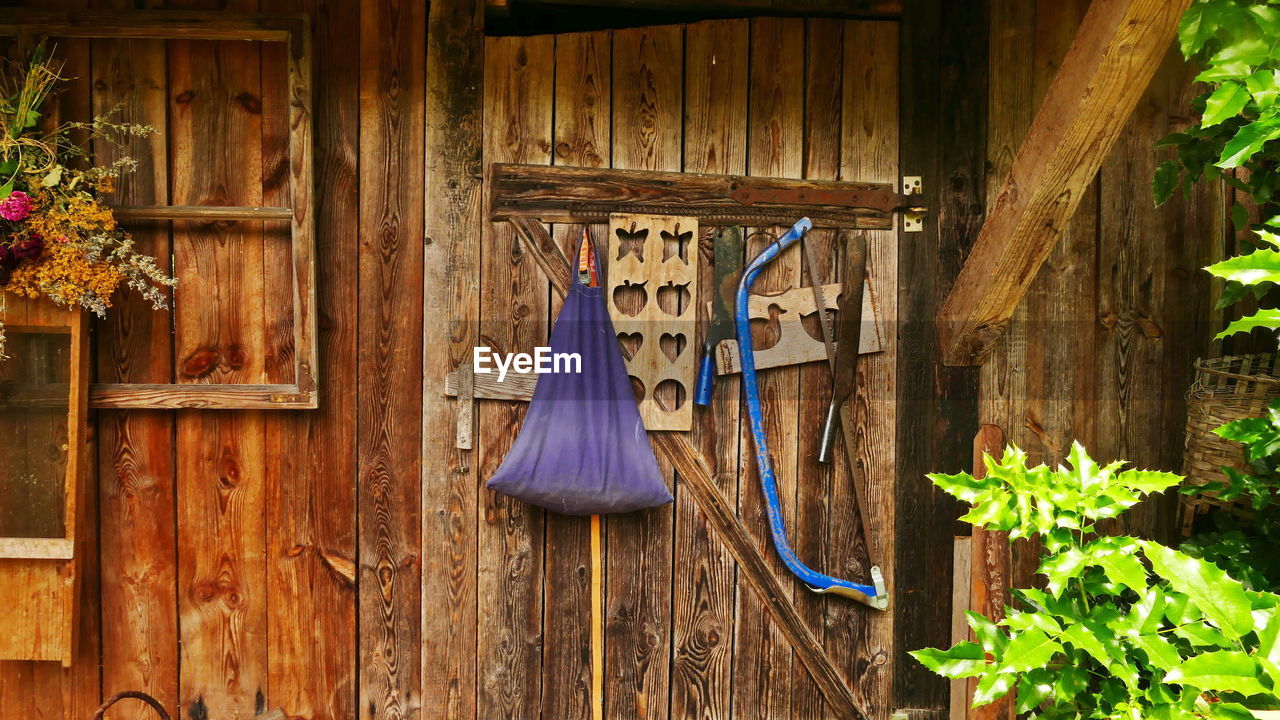 CLOTHES HANGING ON WALL IN HOUSE