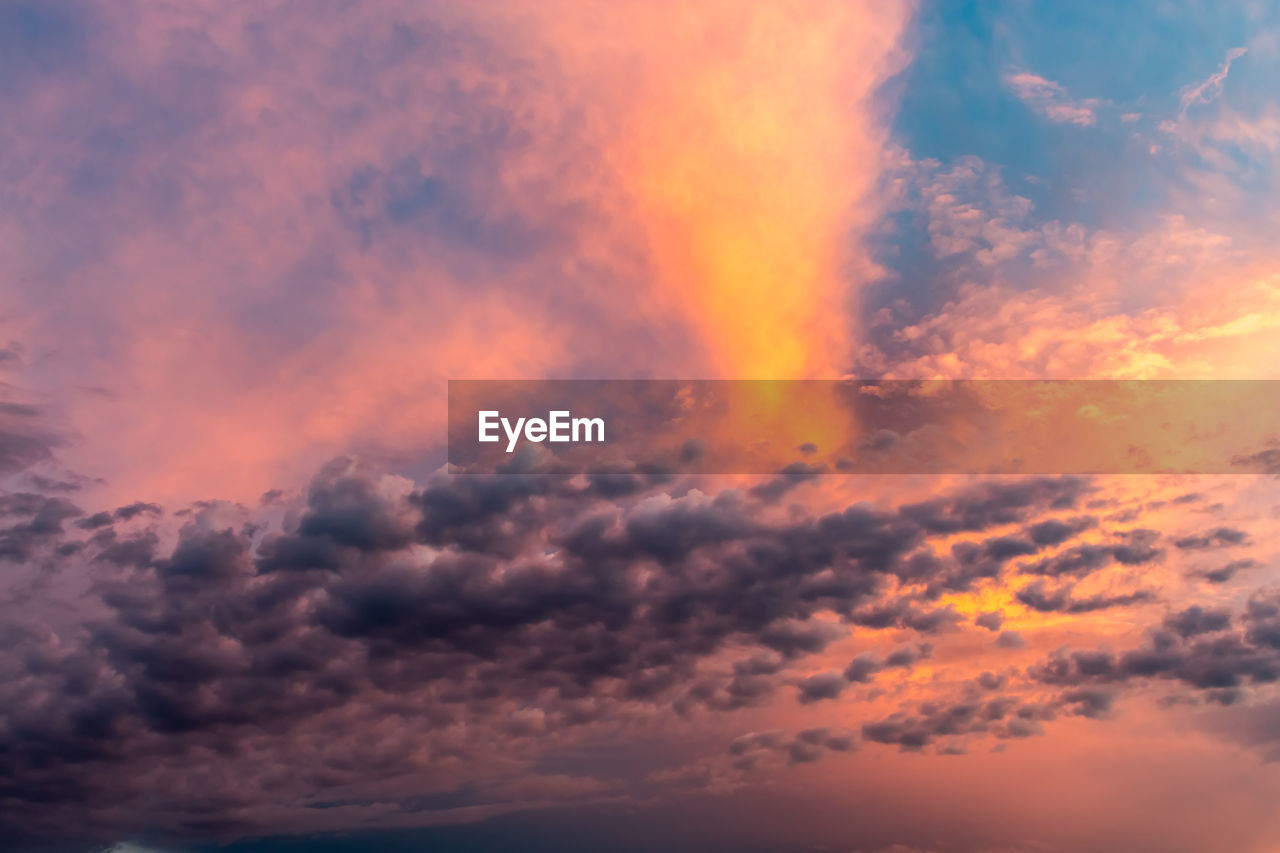 LOW ANGLE VIEW OF ORANGE CLOUDS IN SKY