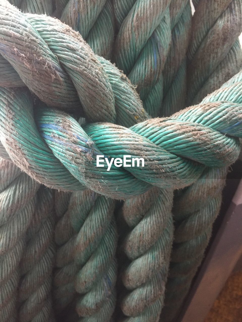 CLOSE-UP OF ROPE TIED UP ON ROPES