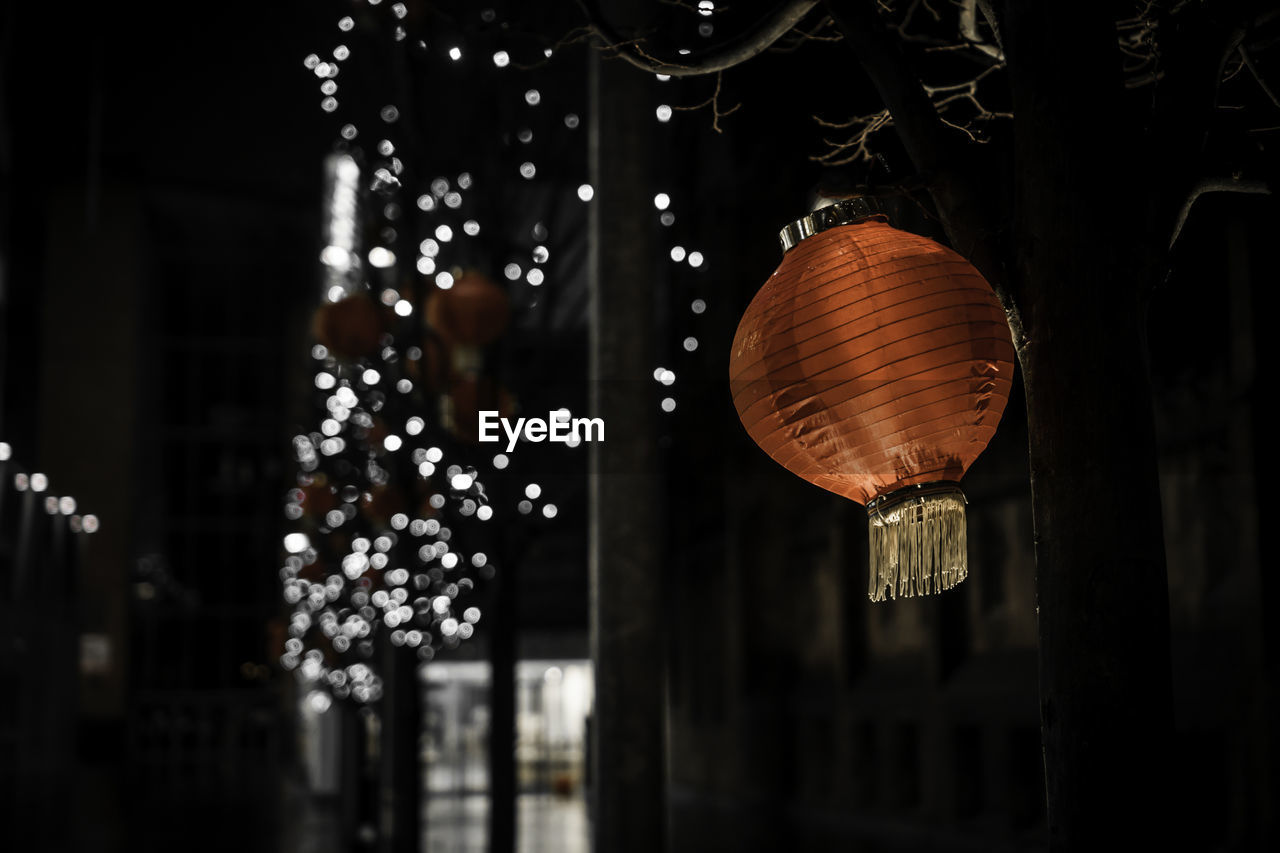 Illuminated lanterns hanging at night