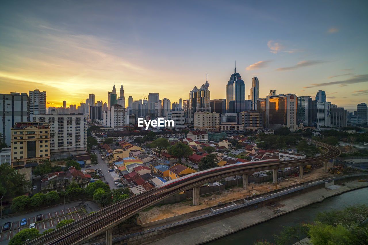 View of cityscape against sky during sunset