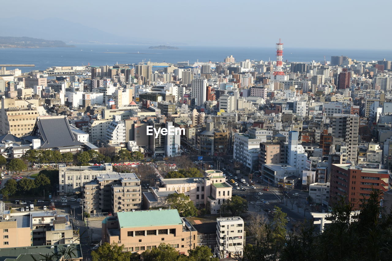 High angle view of buildings in city against sky