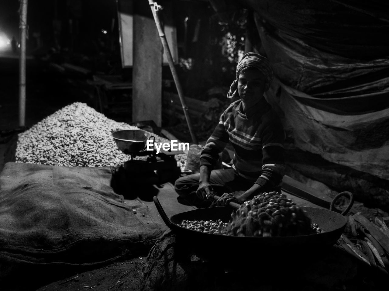 High angle view of man selling peanut at market