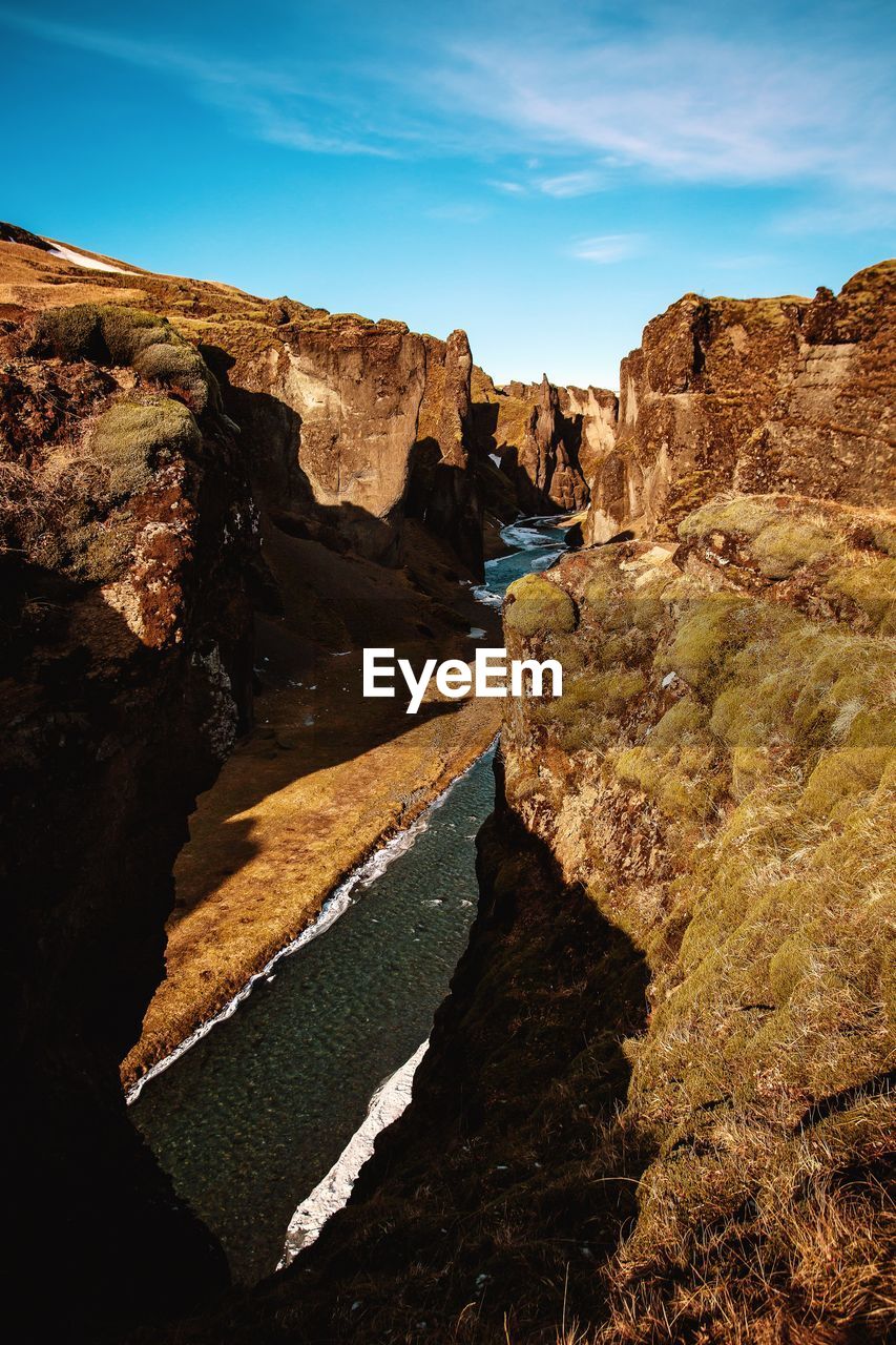 SCENIC VIEW OF SEA AND ROCK FORMATION AGAINST SKY