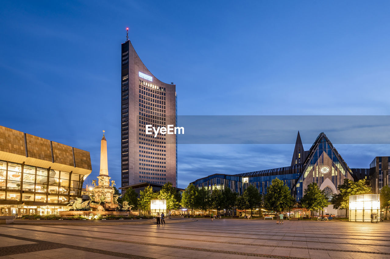 Germany, saxony, leipzig, augustusplatz at dusk with city-hochhaus, gewandhaus and paulinum in background