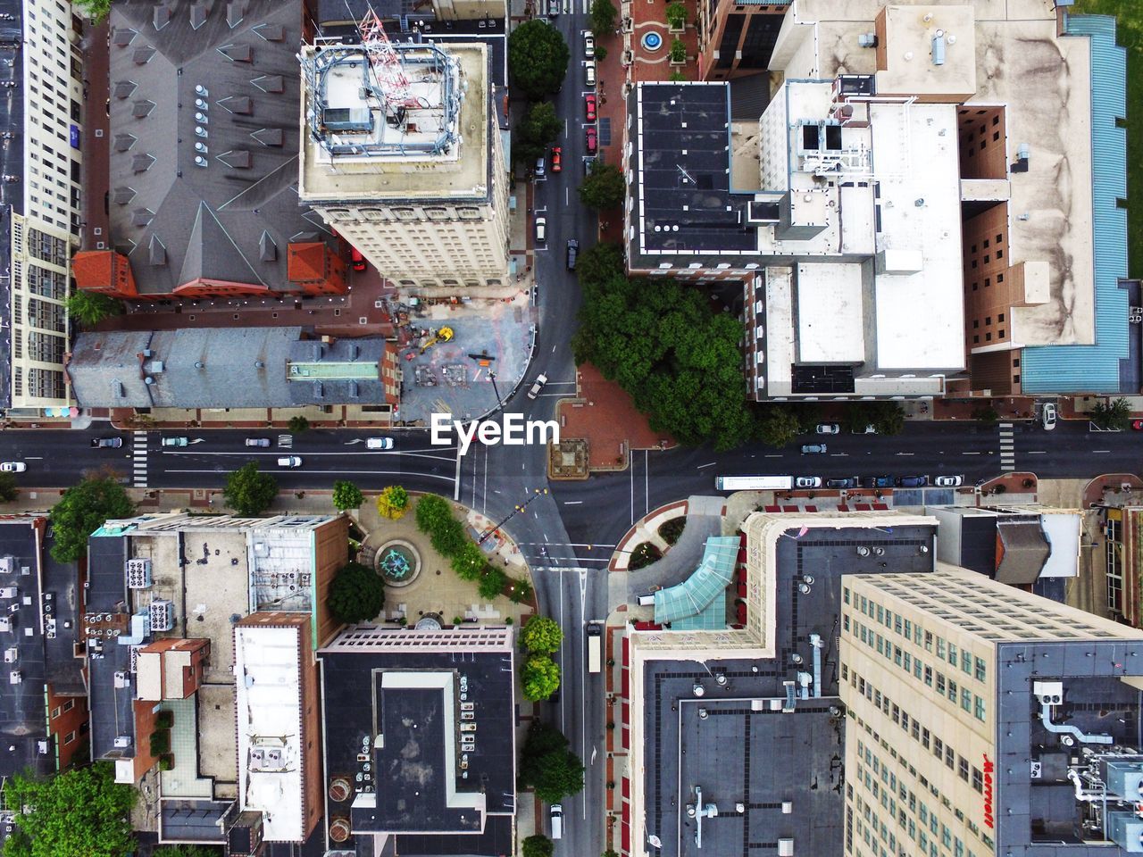 Directly above shot of road by buildings in city