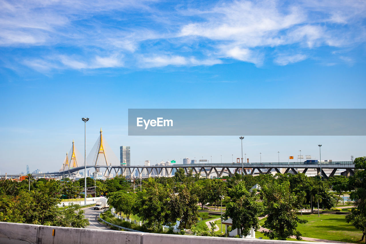 VIEW OF BRIDGE OVER STREET AGAINST SKY